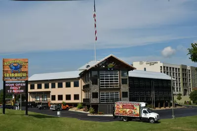 Storefront of Harpoon Harry's Crab House with truck in front