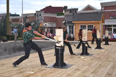 lumberjacks cutting wood at the lumberjack feud