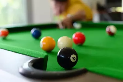 A man playing a game of pool.