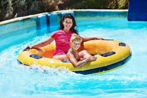 mom and child on a water slide