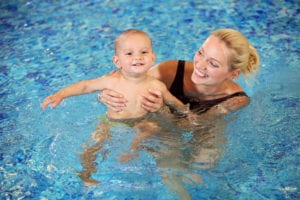 mother and baby swimming in pigeon forge cabin indoor pool